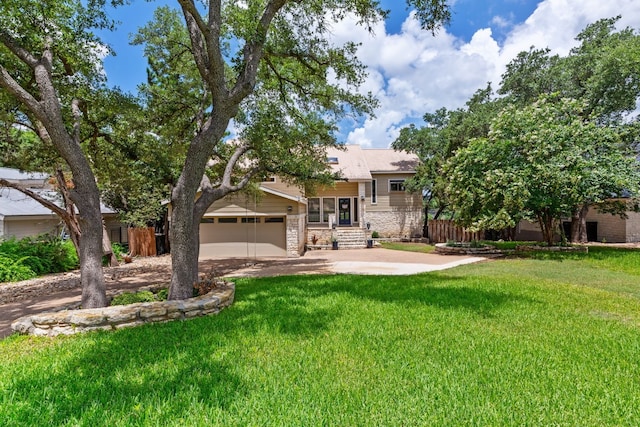 view of front of house featuring a garage and a front yard