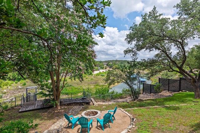 view of yard featuring an outdoor fire pit