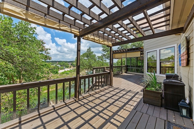 wooden deck featuring a pergola