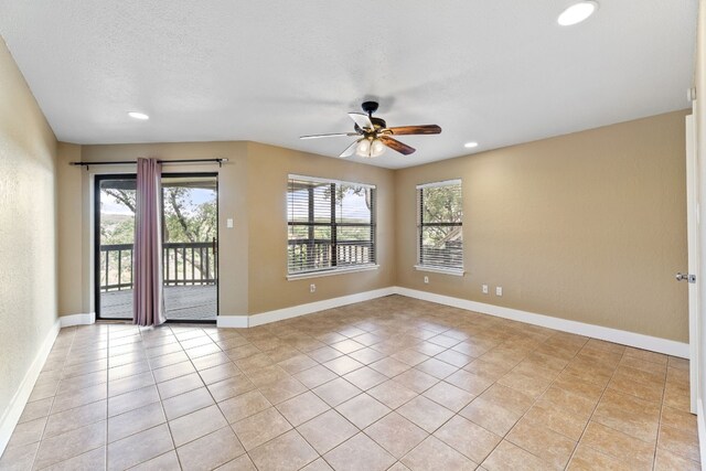 empty room with light tile patterned floors, baseboards, ceiling fan, and recessed lighting