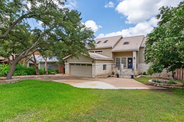 view of front facade featuring a garage, a front lawn, fence, stone siding, and concrete driveway