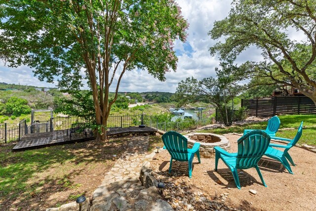 view of yard featuring a fenced backyard and an outdoor fire pit