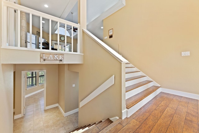 stairway featuring hardwood / wood-style flooring