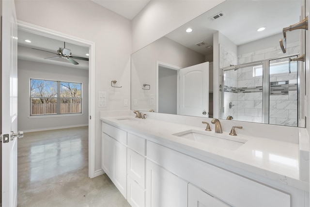 bathroom with ceiling fan, vanity, concrete floors, and a shower with shower door