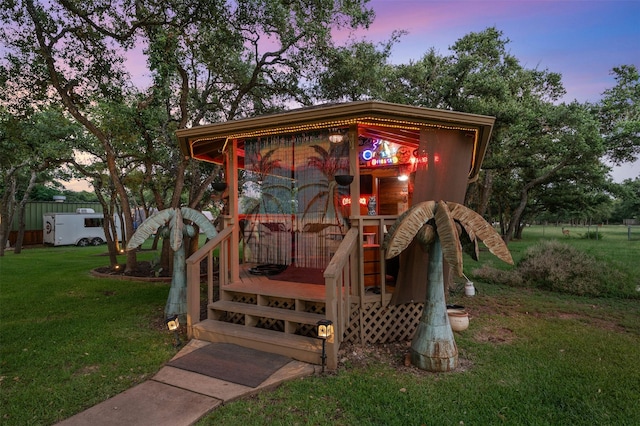 deck at dusk with a yard