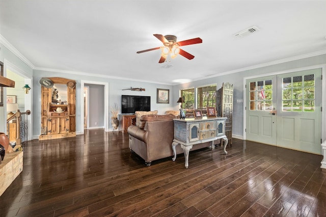 living room with ceiling fan, dark hardwood / wood-style flooring, and ornamental molding