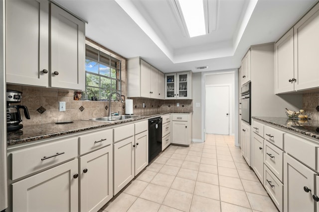 kitchen featuring sink, white cabinets, and black appliances