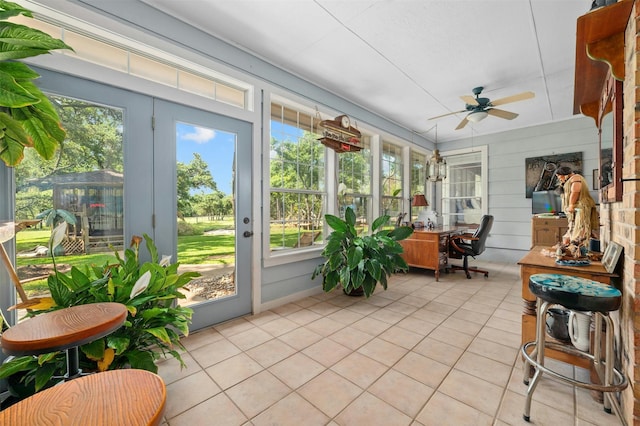 sunroom featuring ceiling fan