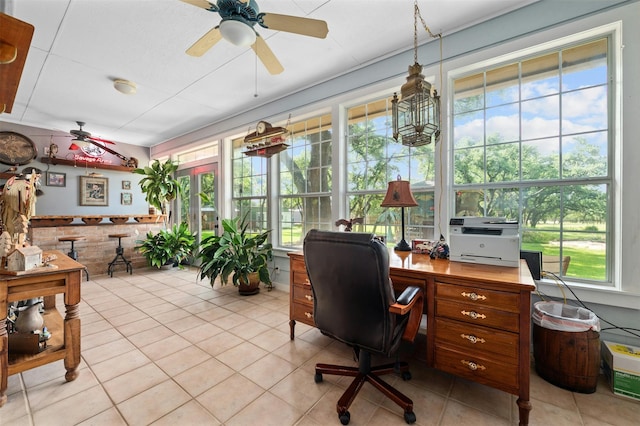 home office with ceiling fan and light tile patterned floors