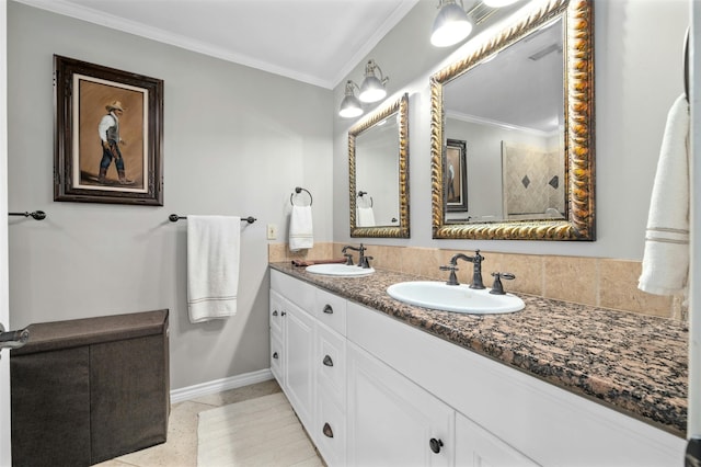 bathroom featuring crown molding, tile patterned floors, and vanity