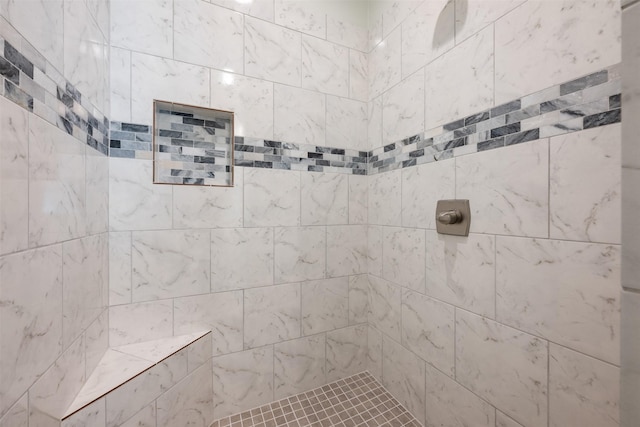 bathroom featuring tiled shower