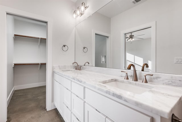 bathroom with concrete flooring, vanity, and ceiling fan