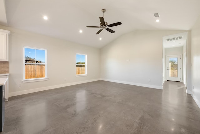 unfurnished living room with ceiling fan, lofted ceiling, and plenty of natural light