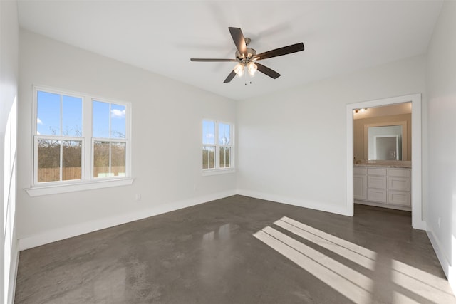 spare room with ceiling fan and a healthy amount of sunlight