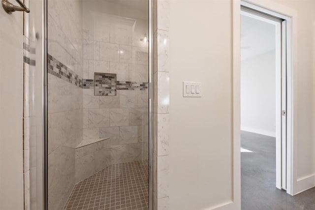 bathroom featuring a shower with door