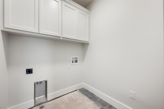 clothes washing area with cabinets, hookup for a washing machine, and hookup for an electric dryer