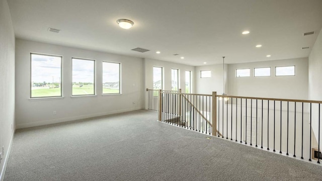 empty room with recessed lighting, baseboards, and carpet floors