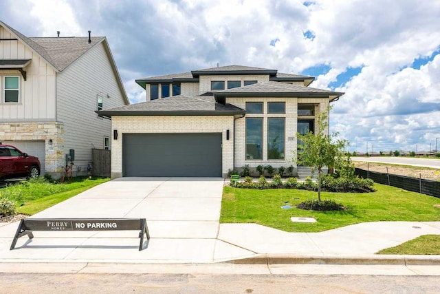 102 Iva Ln, Georgetown, TX 78628 - view of front of property with a garage, concrete driveway, roof with shingles, brick siding, and board and batten siding