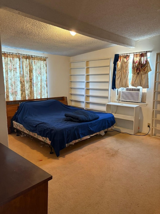 carpeted bedroom with cooling unit and a textured ceiling