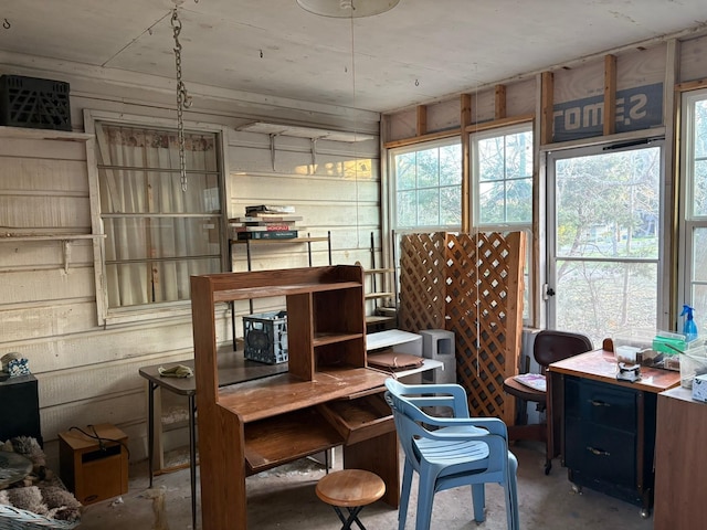 home office with concrete flooring