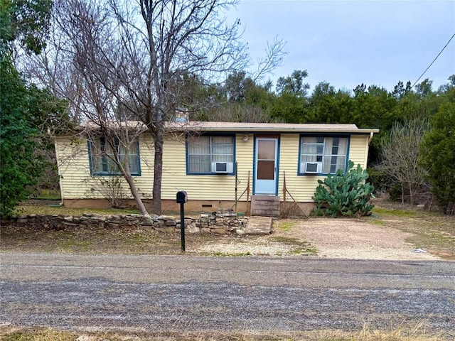 ranch-style house with cooling unit