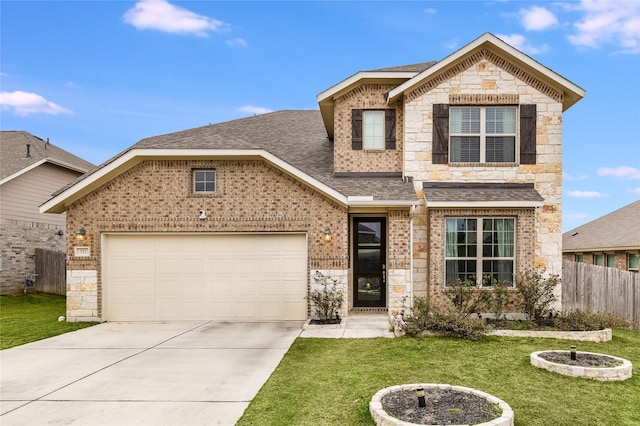 view of front of property featuring a front lawn and a garage