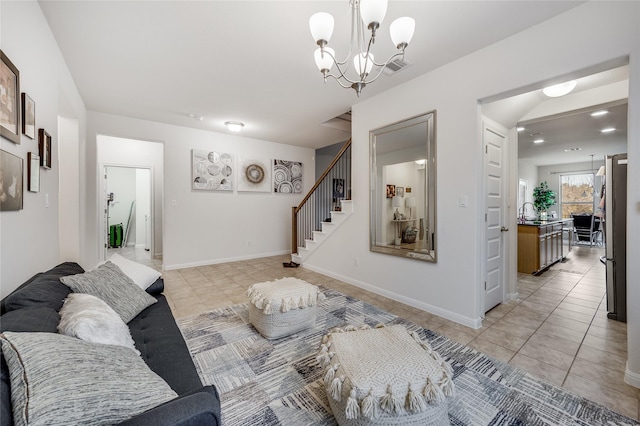 tiled living room featuring sink and a notable chandelier