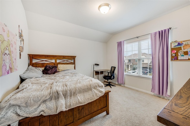 bedroom featuring light carpet and vaulted ceiling