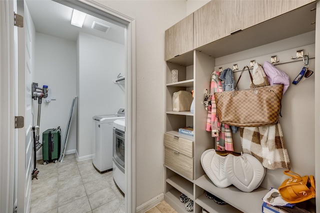 laundry area with washing machine and dryer