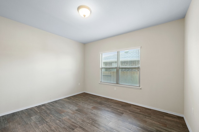 unfurnished room featuring dark hardwood / wood-style floors