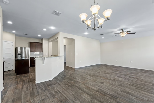 kitchen featuring dark brown cabinetry, dark wood-type flooring, hanging light fixtures, stainless steel refrigerator with ice dispenser, and ceiling fan with notable chandelier