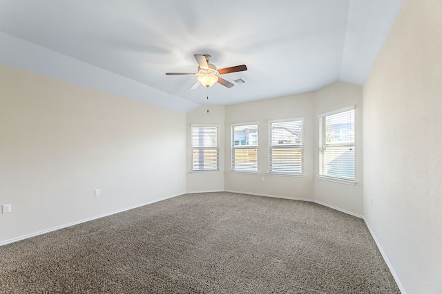 empty room featuring carpet flooring, ceiling fan, and vaulted ceiling