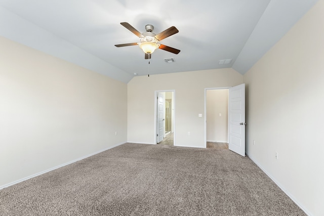 carpeted empty room featuring ceiling fan and lofted ceiling