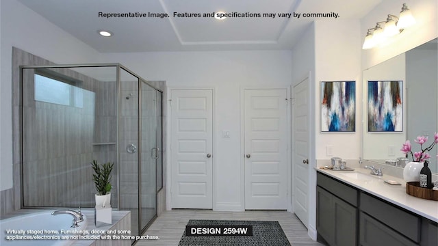 bathroom with vanity and independent shower and bath