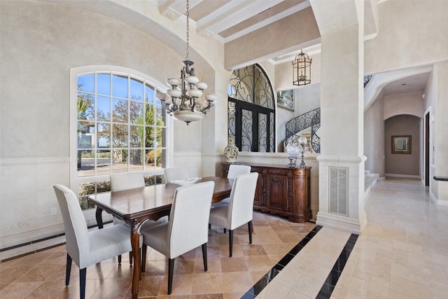 dining area with french doors and a notable chandelier