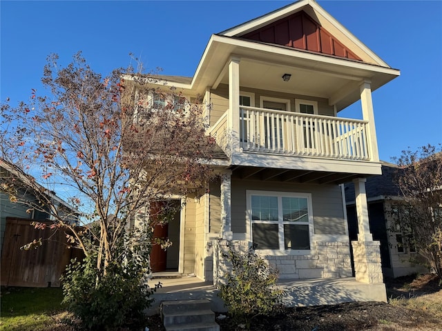 craftsman-style home featuring a balcony