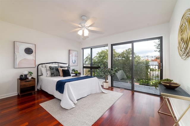 bedroom featuring ceiling fan, dark hardwood / wood-style flooring, and access to outside