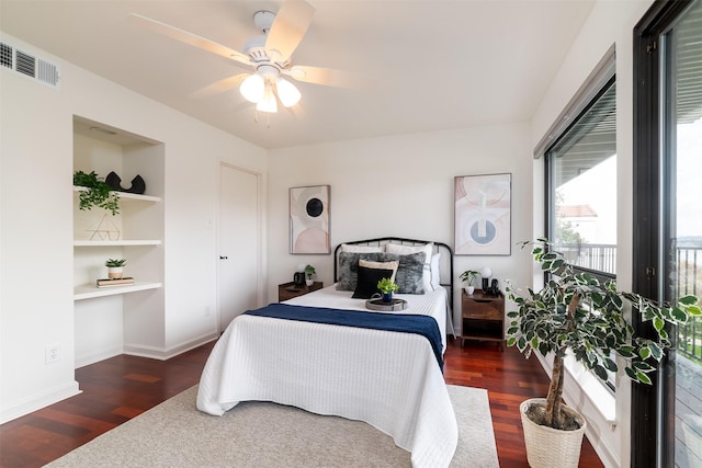 bedroom with ceiling fan and dark hardwood / wood-style floors