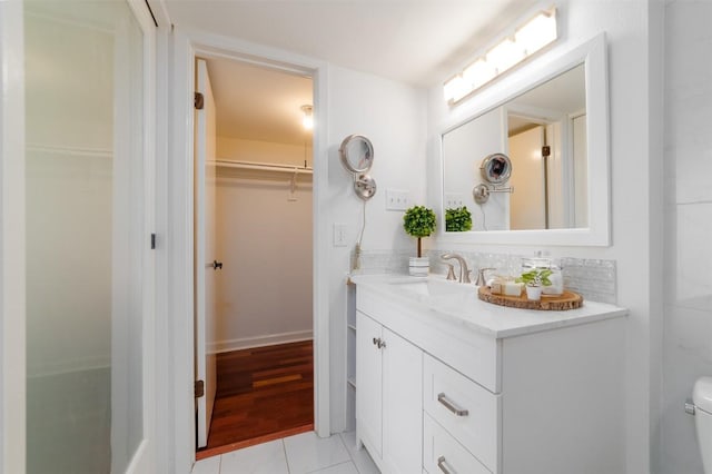 2918 Ranch Road 620th Rd N Unit B-109, Austin, TX 78734 - bathroom with vanity, a spacious closet, and tile patterned floors
