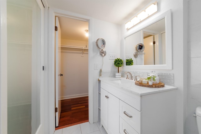 bathroom featuring tile patterned flooring and vanity