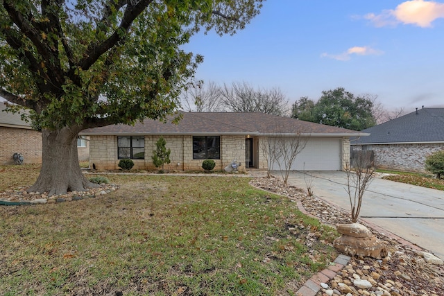 ranch-style house with a front lawn and a garage