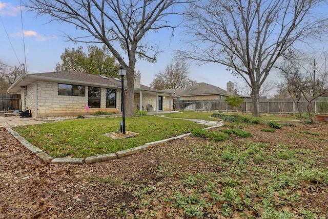 view of yard featuring a patio area and a fenced backyard