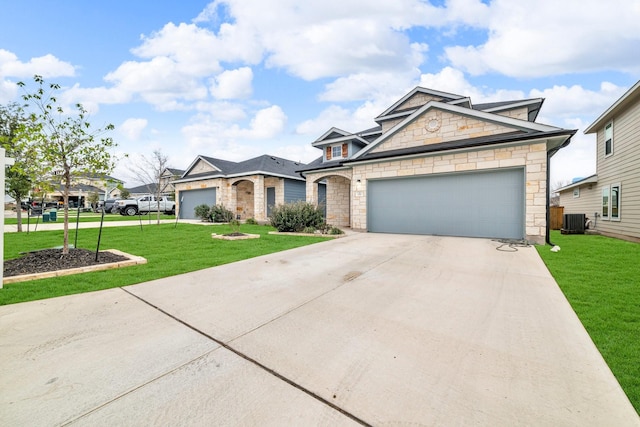 view of front of property with cooling unit, a front yard, and a garage