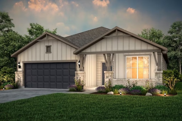 view of front of home featuring a yard and a garage