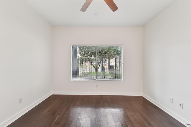 empty room featuring dark hardwood / wood-style floors and ceiling fan