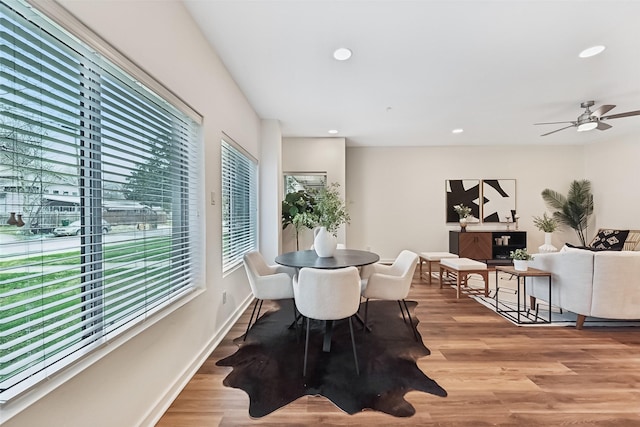 dining room with light wood-type flooring and ceiling fan