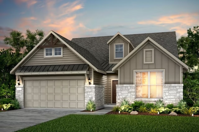 view of front facade with a lawn and a garage