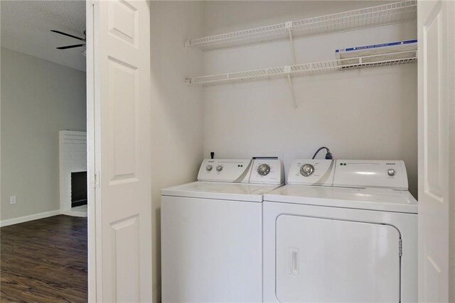 9507 Kempler Dr, Austin, TX 78748 - washroom with washing machine and clothes dryer, dark wood finished floors, and baseboards