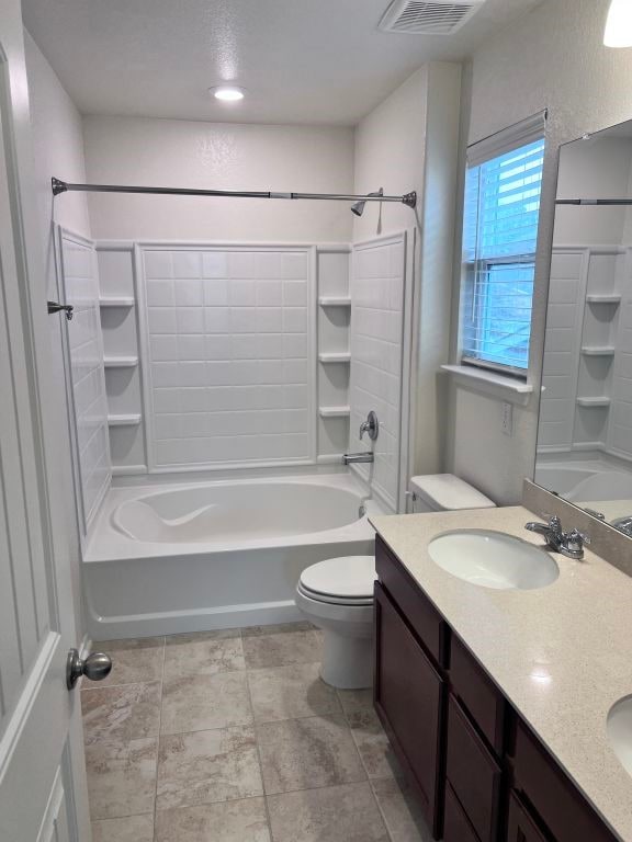 full bathroom featuring vanity, toilet, and shower / bathtub combination