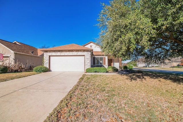 view of front of home with a front lawn and a garage